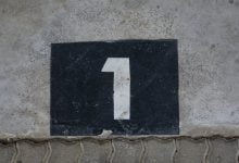 sign with house number on wall