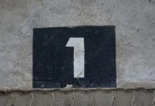 sign with house number on wall